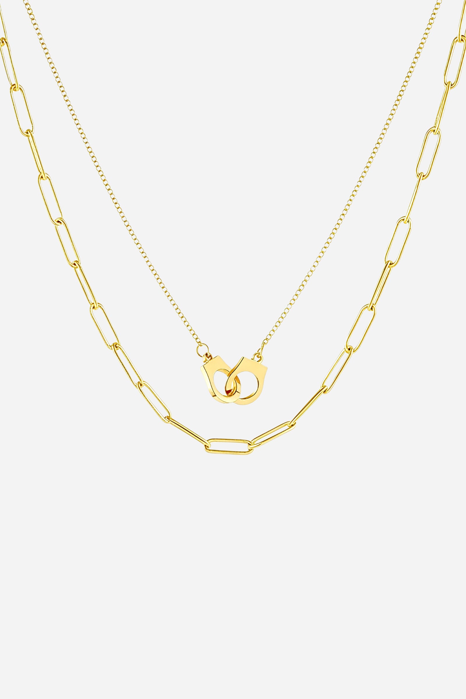 Top-view image of GLISTIA layered gold necklace featuring interlocked handcuff pendant.