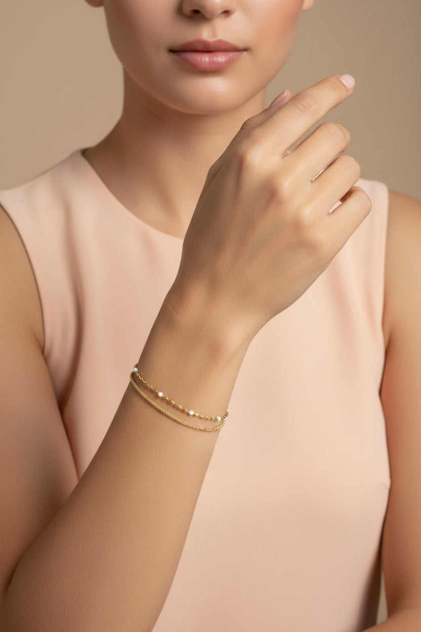 White Beaded Dual Chain bracelet in 18K PVD gold plated stainless steel with elegant white bead detailing