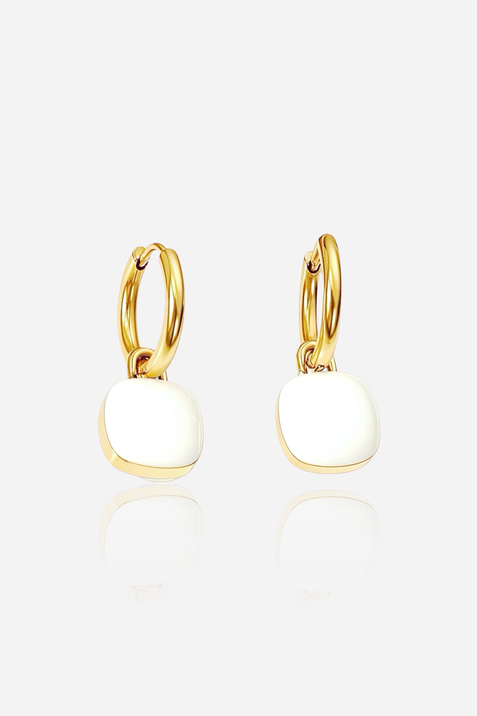 White charm drop hoop earrings made from premium stainless steel with a polished PVD 18K gold plated finish, featuring glossy white enamel square charms - GLISTIA.