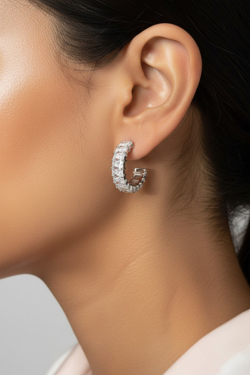 Zirconia C-hoop earrings crafted from stainless steel with a polished silver tone and a row of sparkling zirconia stones